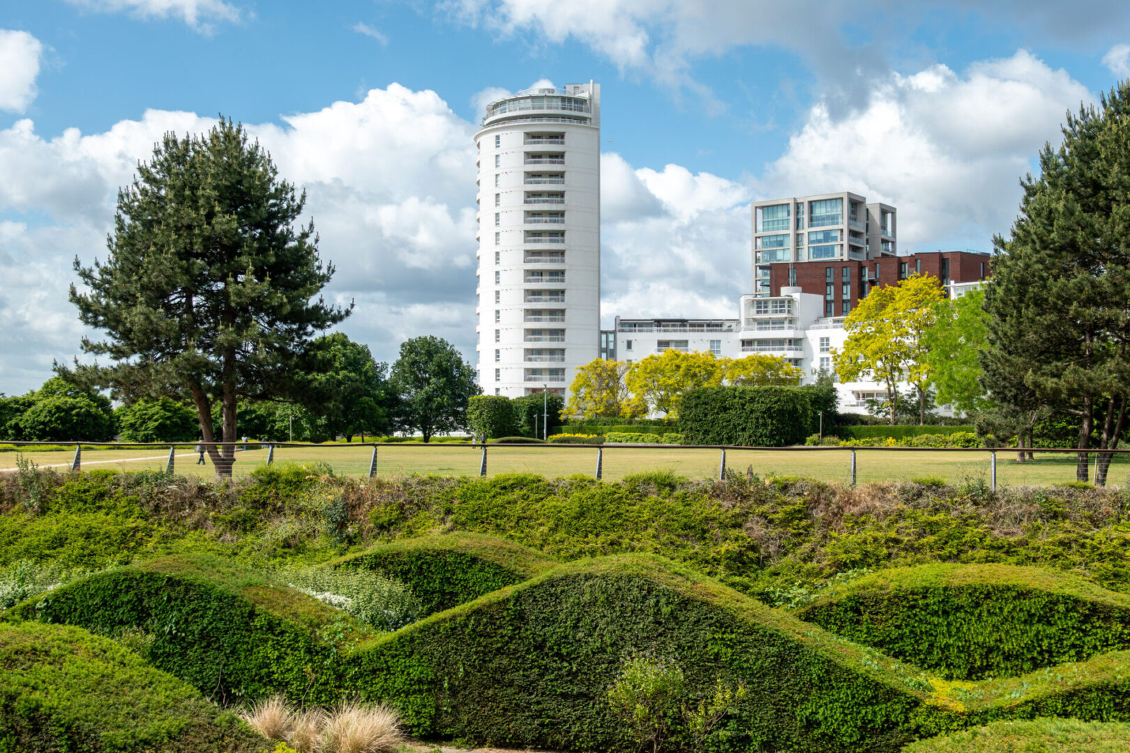 Park with modern buildings in the background.